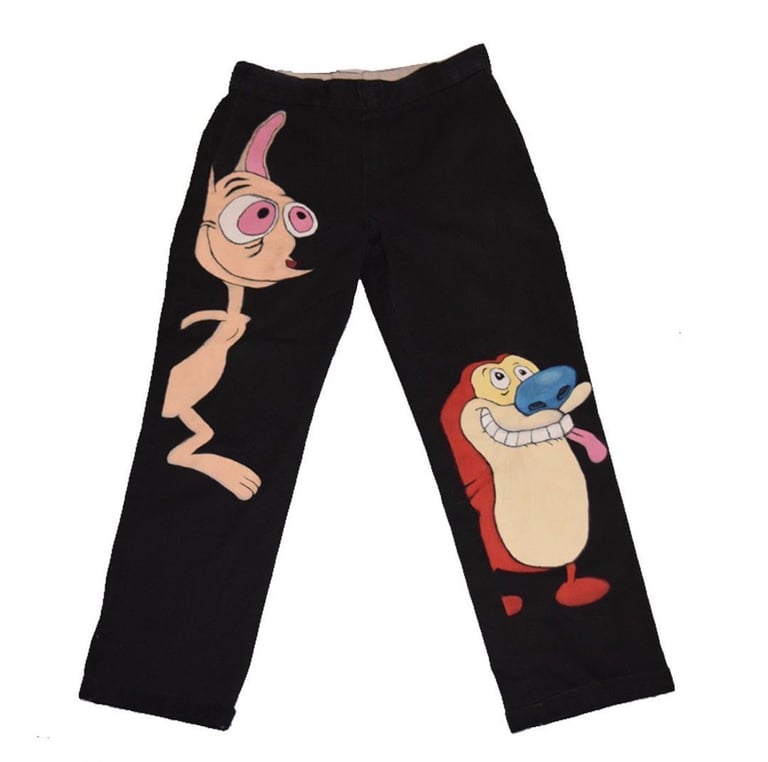Black pajama pants with cartoon character prints featuring a pink-haired boy and a character in red on the legs