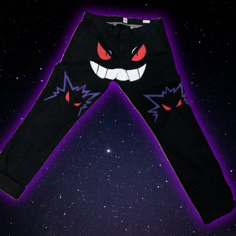 Black pants with glowing purple edges and Haunter Pokemon face design featuring red eyes and grinning mouth on leg