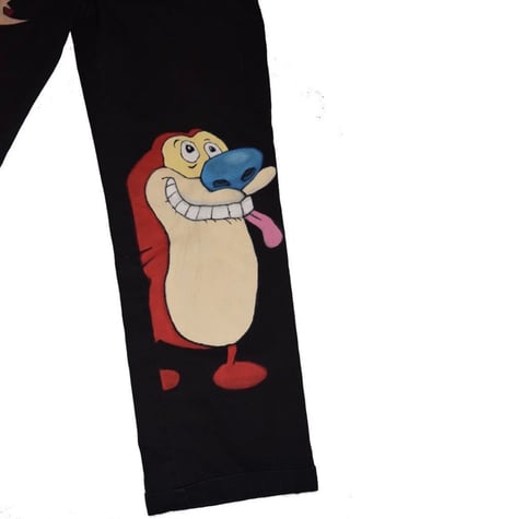Cartoon character with red hair and cream-colored body wearing blue gloves, printed on black fabric sleeve