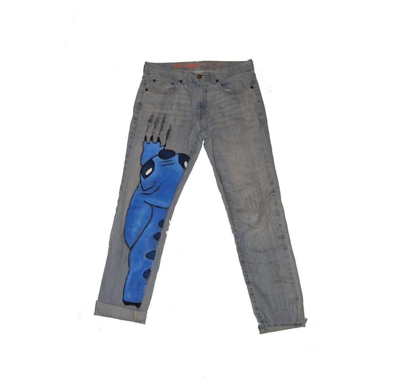 Gray jeans with blue abstract coffin design printed on left leg