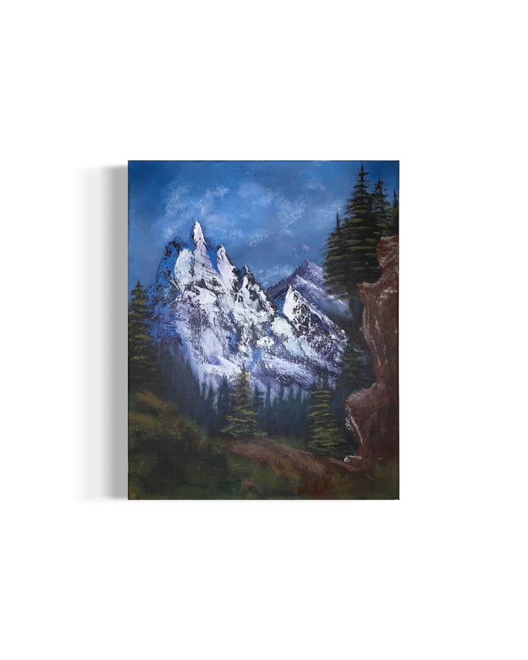 Canvas painting of snow-capped mountain peaks surrounded by evergreen forest under a blue sky