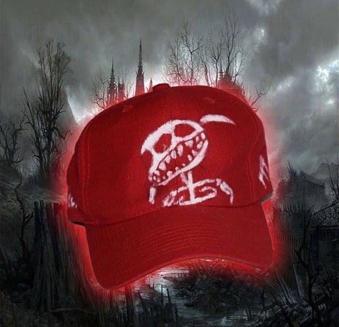 Glowing red baseball cap with white logo hovering over dark, apocalyptic cityscape with bare trees and stormy sky